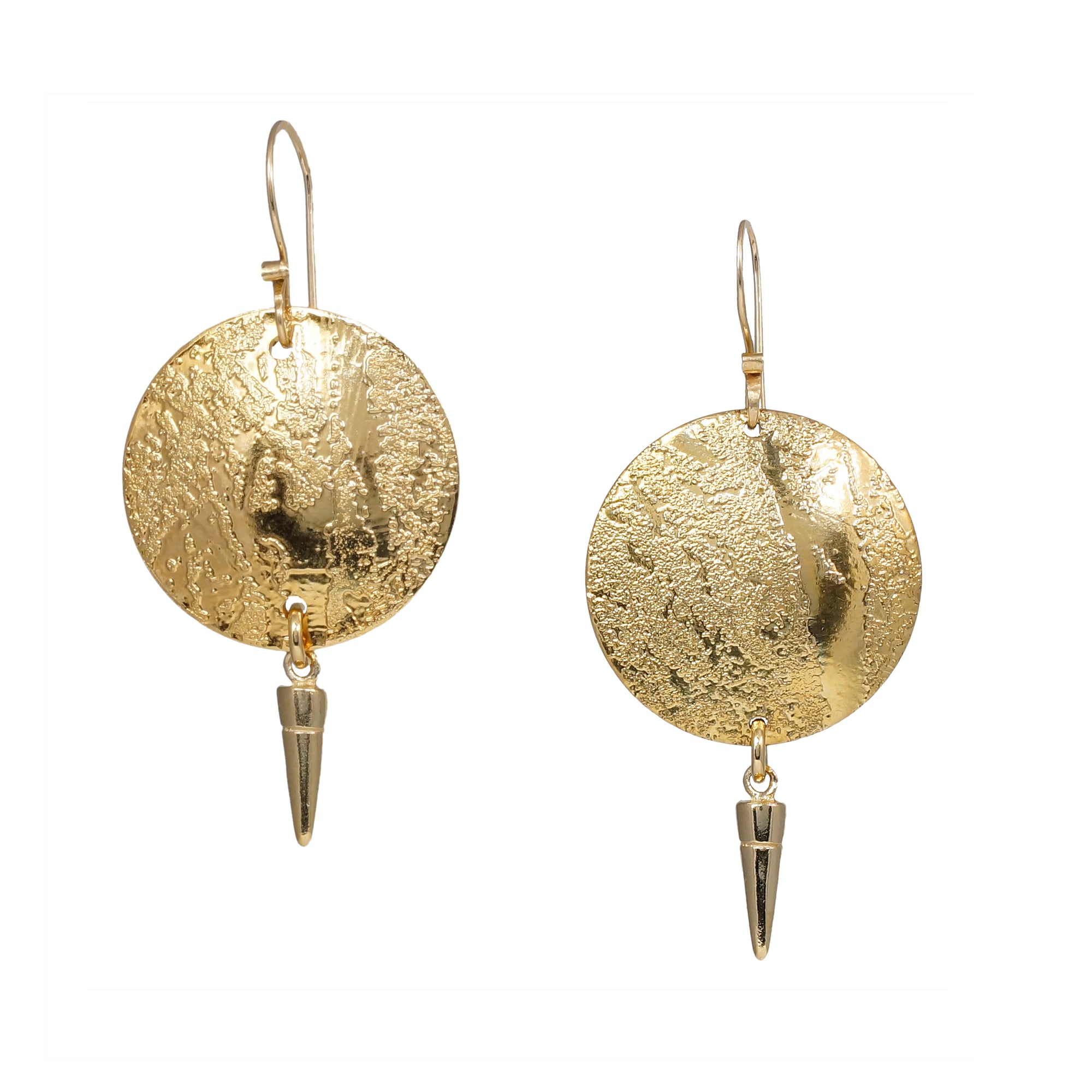 Gold earrings with circular designs and spike-like elements on a white background