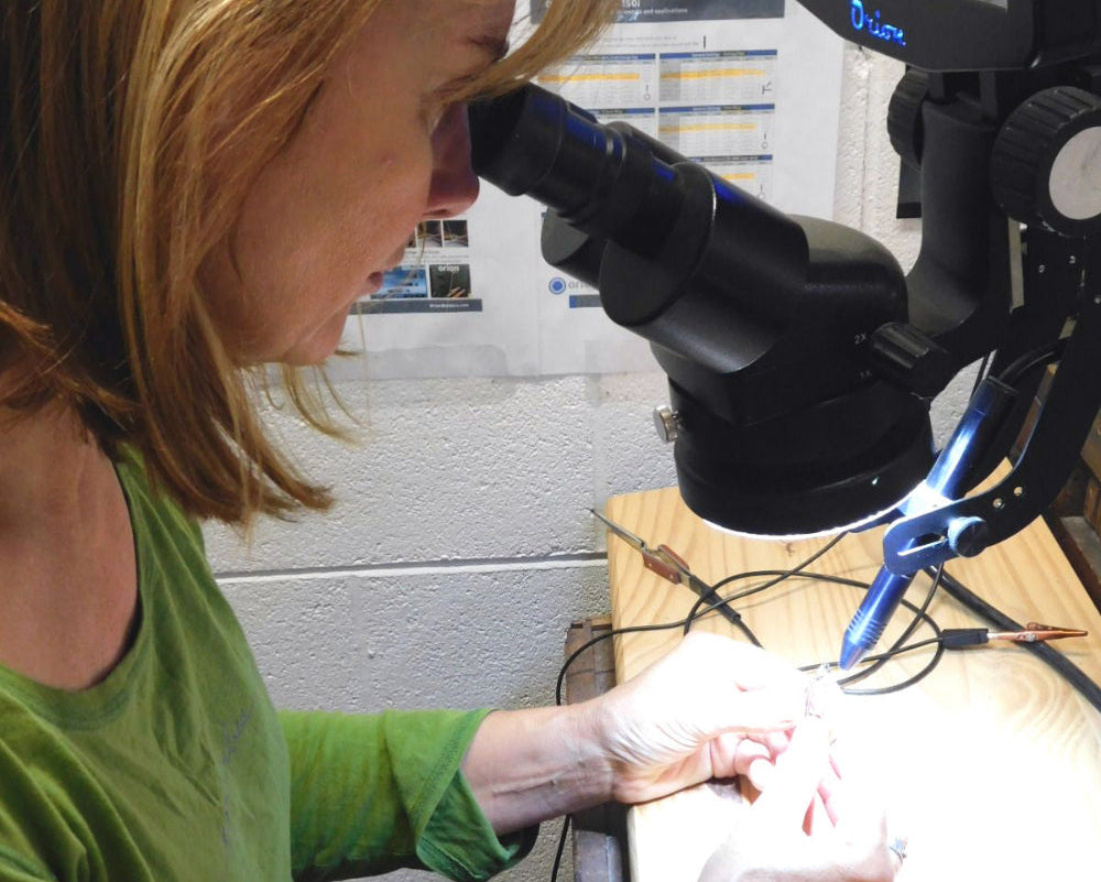 Q Evon welding a ring in her studio