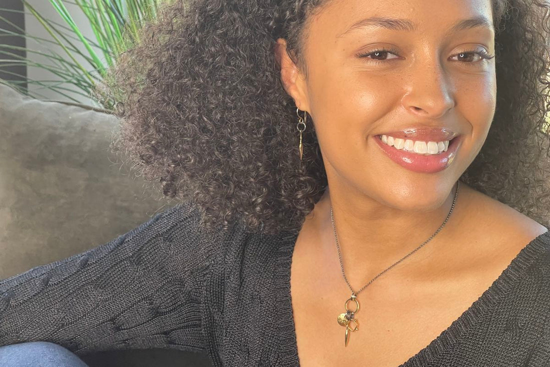 woman wearing metal elements necklace