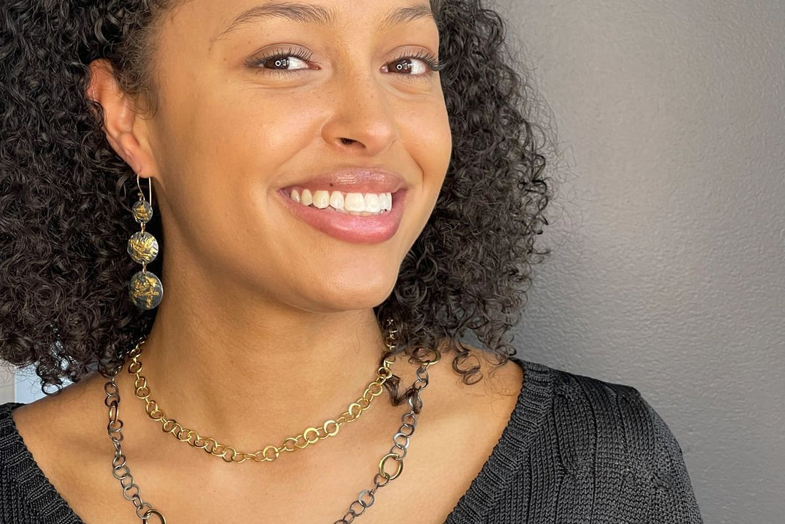 woman wearing Keum-boo earrings