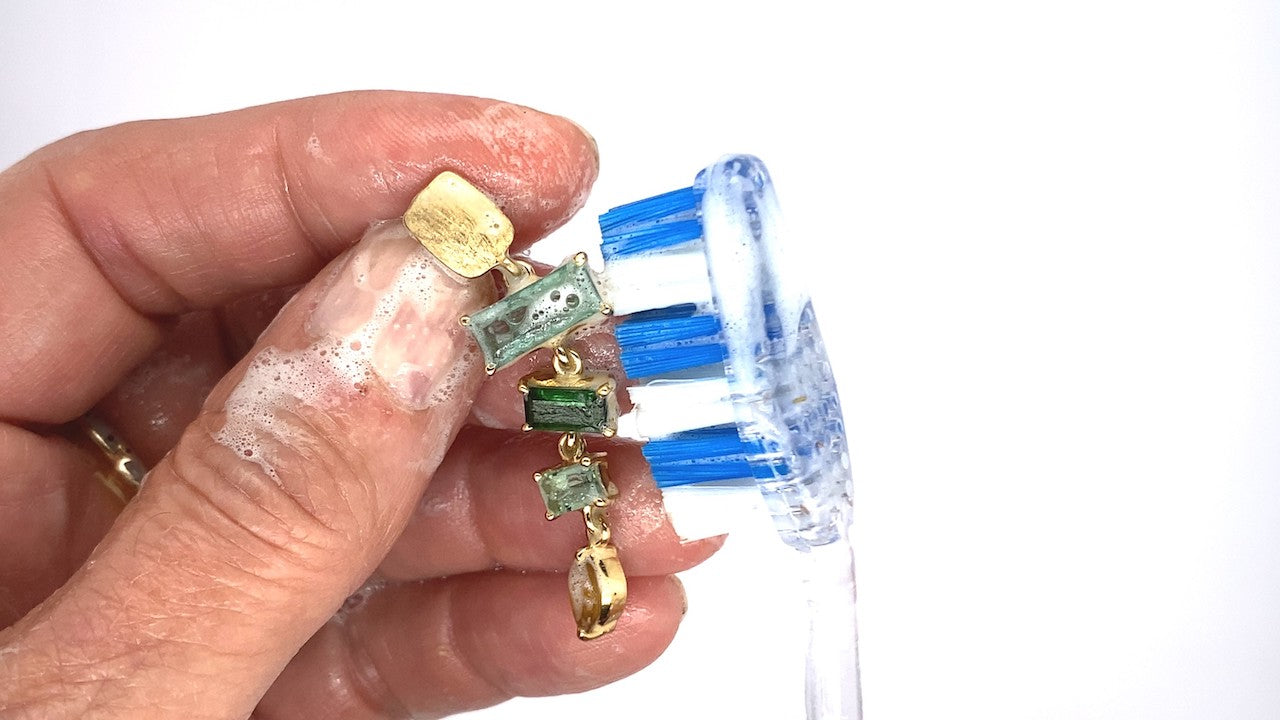cleaning jewelry with toothbrush