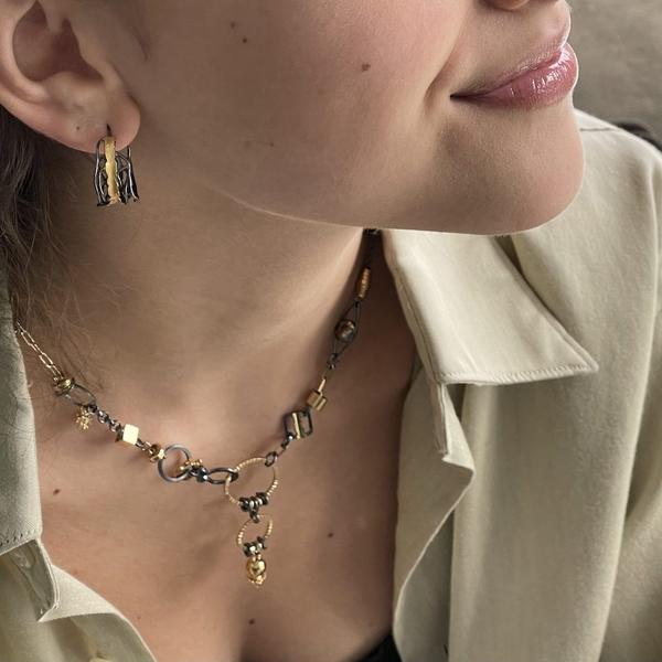 wearing necklace and earrings