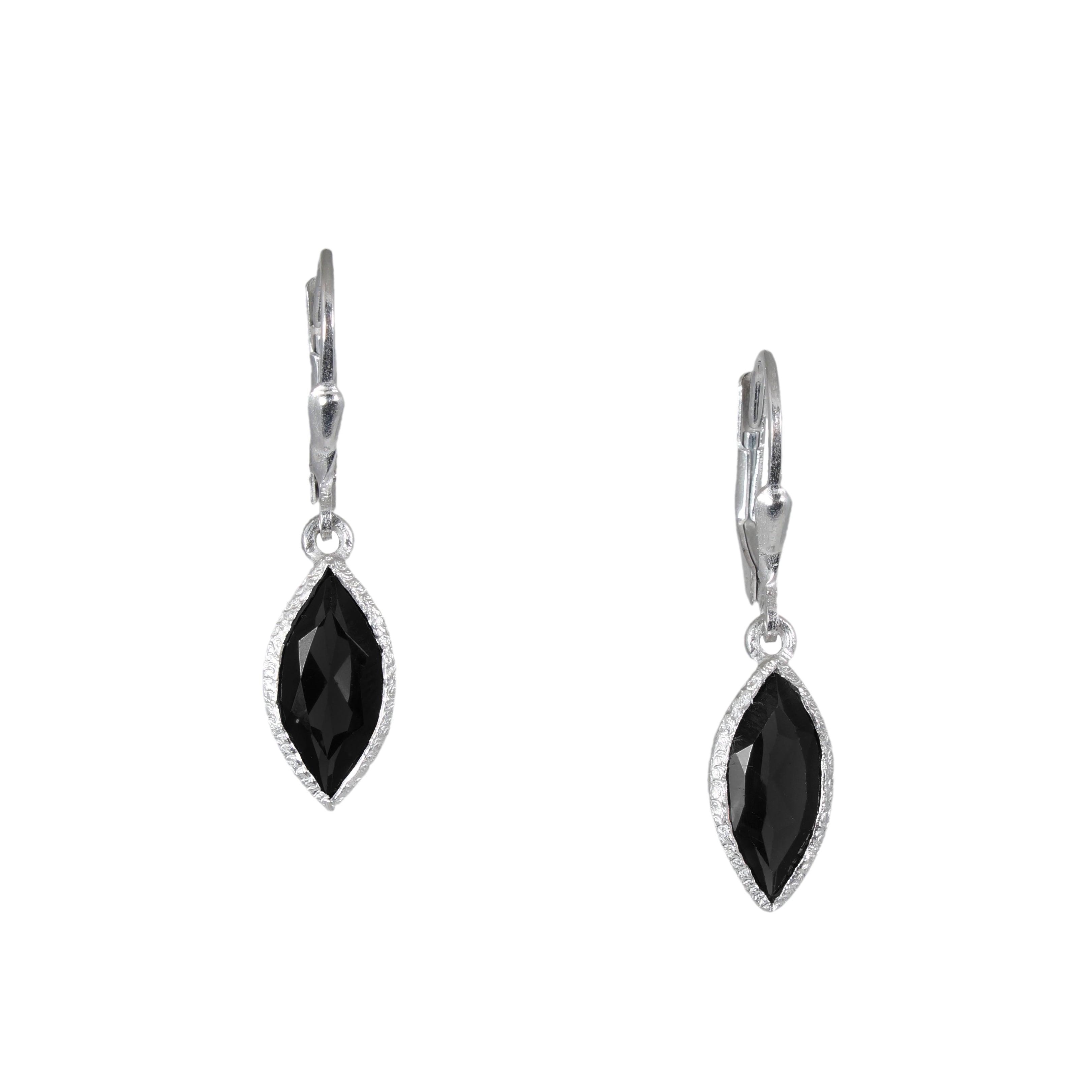 Pair of black teardrop earrings on a white background