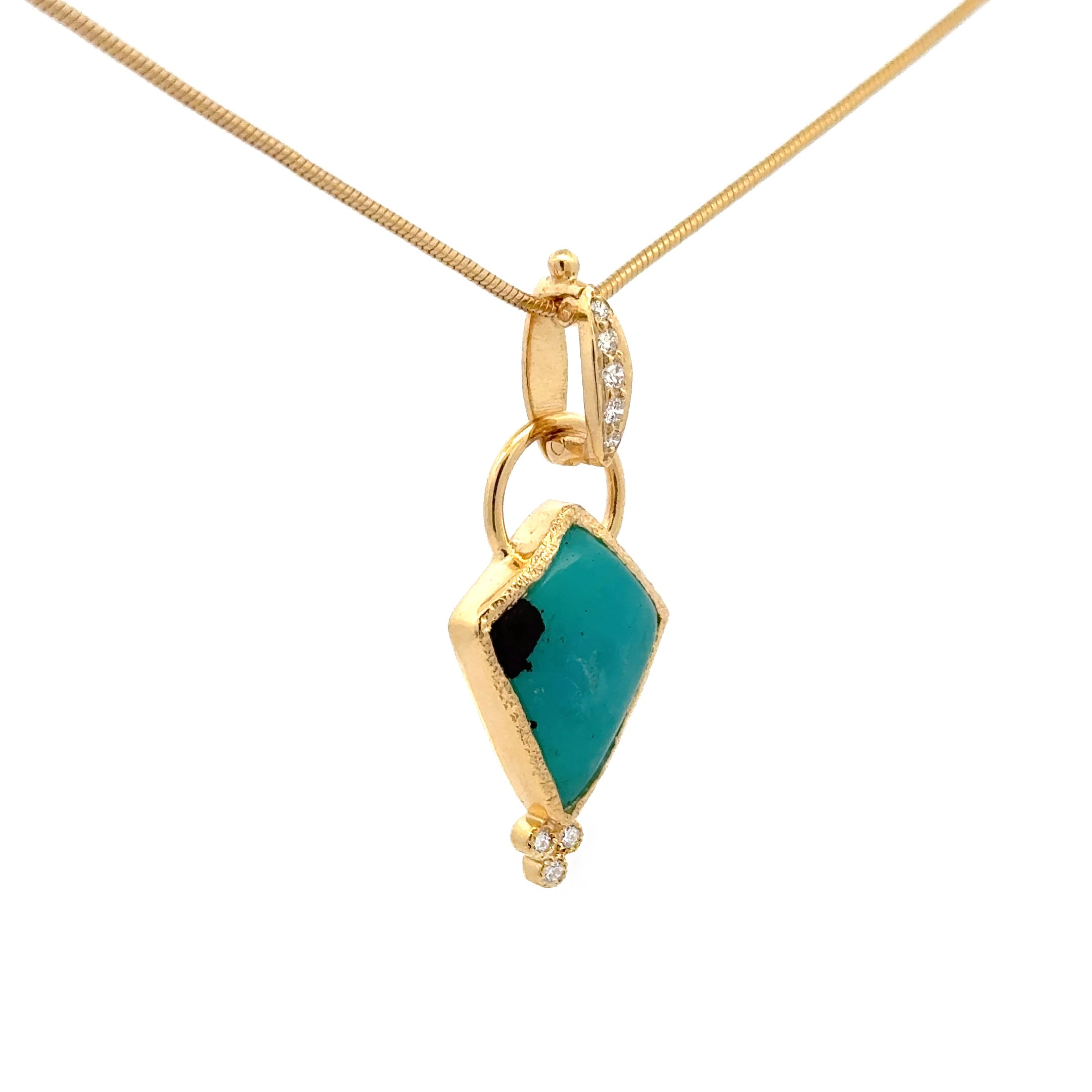 Side view of 14k gold gem silica and diamond pendant