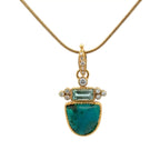 A gold pendant necklace featuring a gem quality gem silica and a rectangular green tourmaline, accented with diamonds, shown on a white background.