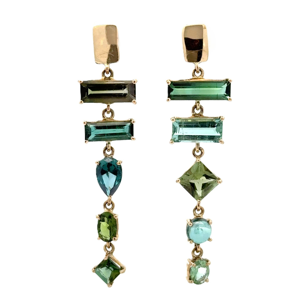 A pair of gold drop earrings featuring multiple green and blue-green gemstones in various shapes including rectangular, pear, and round, set against a plain white background.