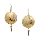 Gold earrings with circular designs and spike-like elements on a white background