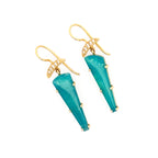 Turquoise earrings with gold hooks on a white background