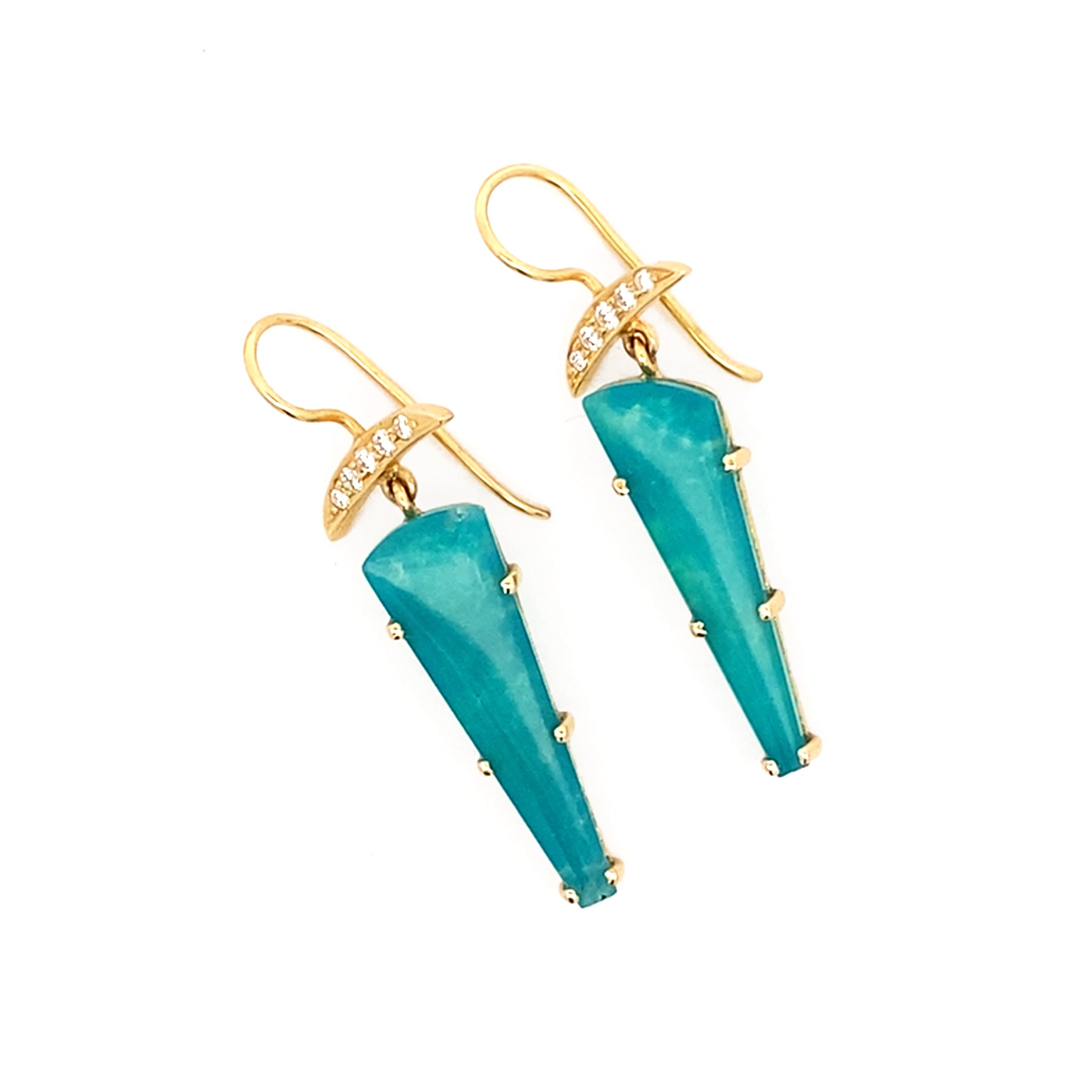 Turquoise earrings with gold hooks on a white background