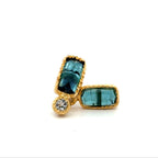 A pair of gold stud earrings featuring rectangular aquamarine gemstones and a small round diamond stone, set against a plain white background.
