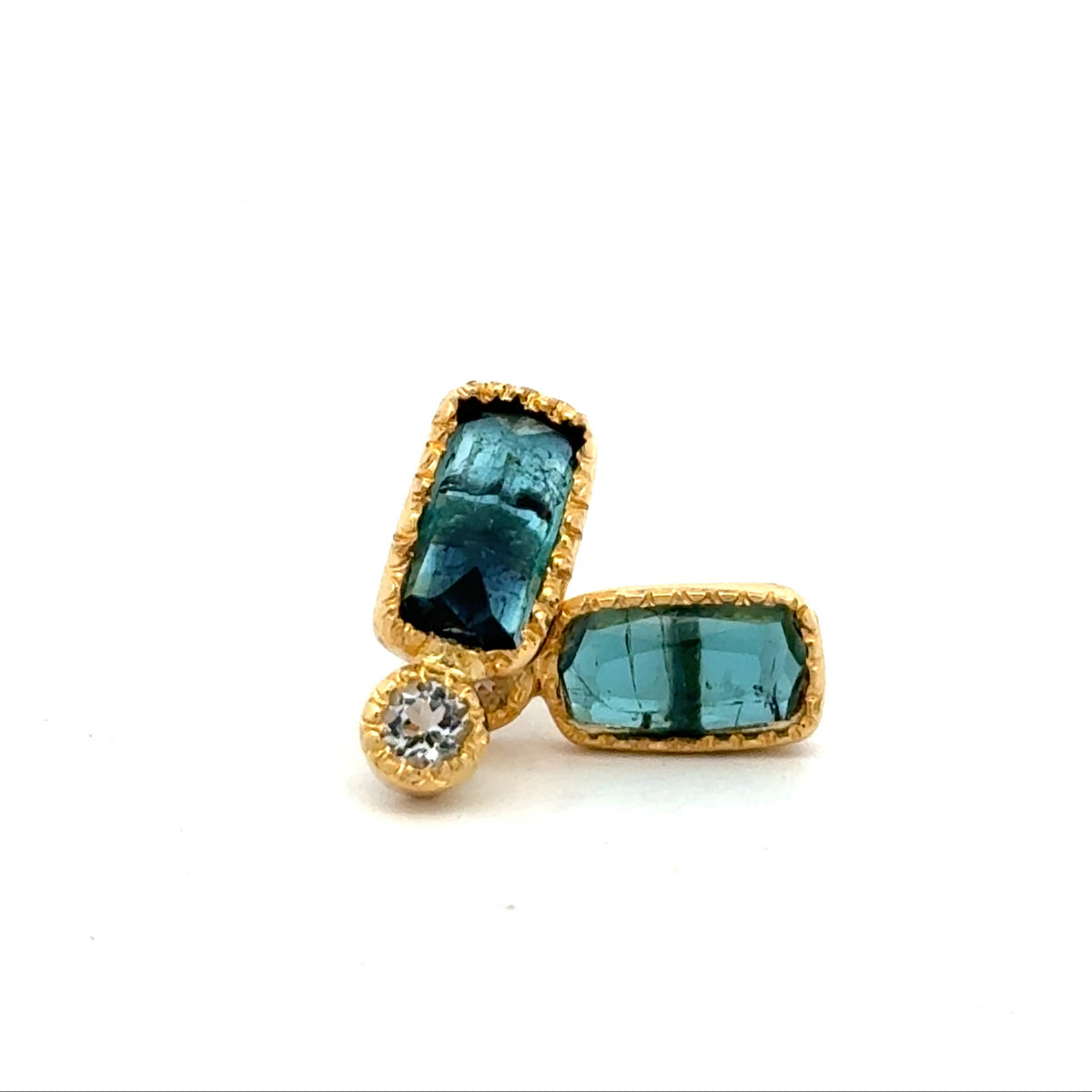 A pair of gold stud earrings featuring rectangular aquamarine gemstones and a small round diamond stone, set against a plain white background.