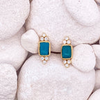 Pair of earrings on white stones
