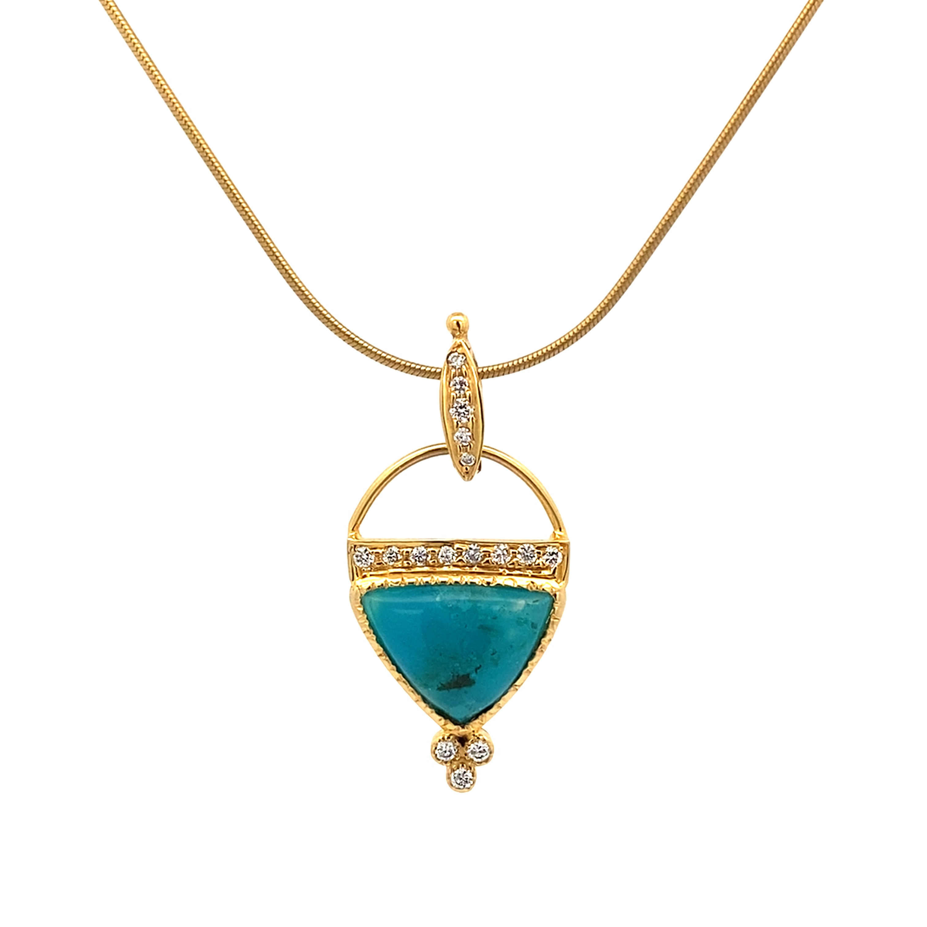 Gold necklace with a turquoise pendant on a white background