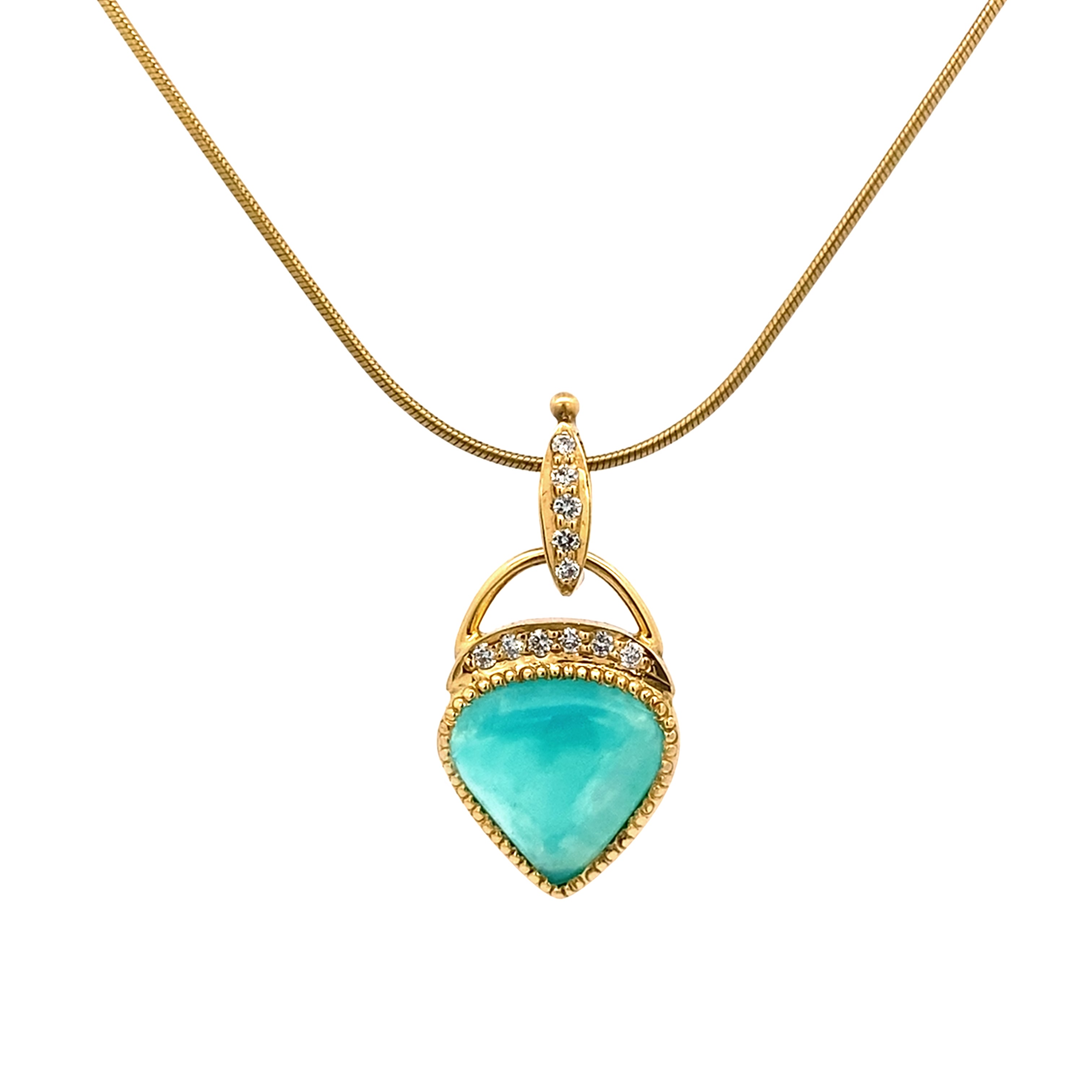Gold necklace with a turquoise pendant on a white background