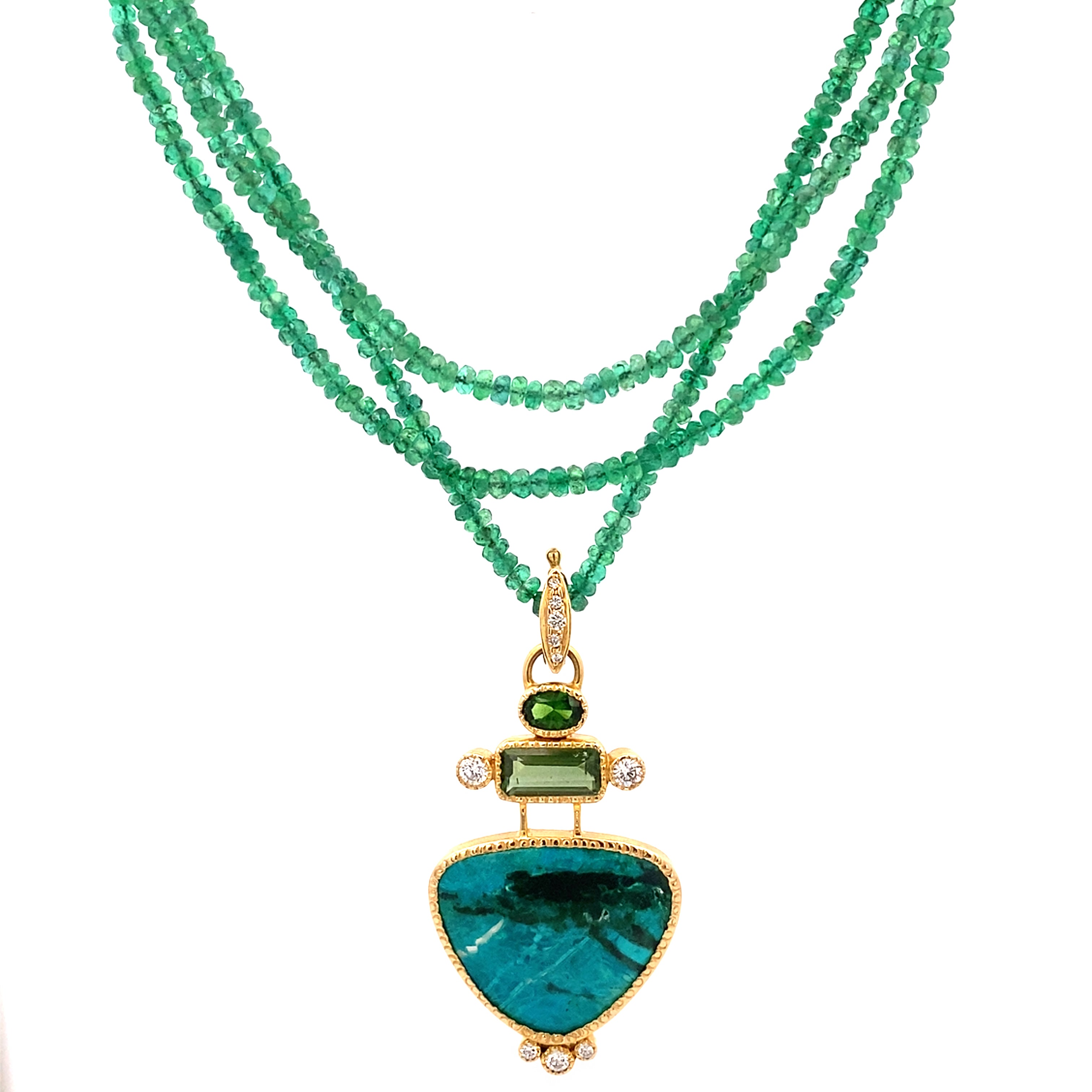 Green gemstone necklace with a gold pendant on a white background