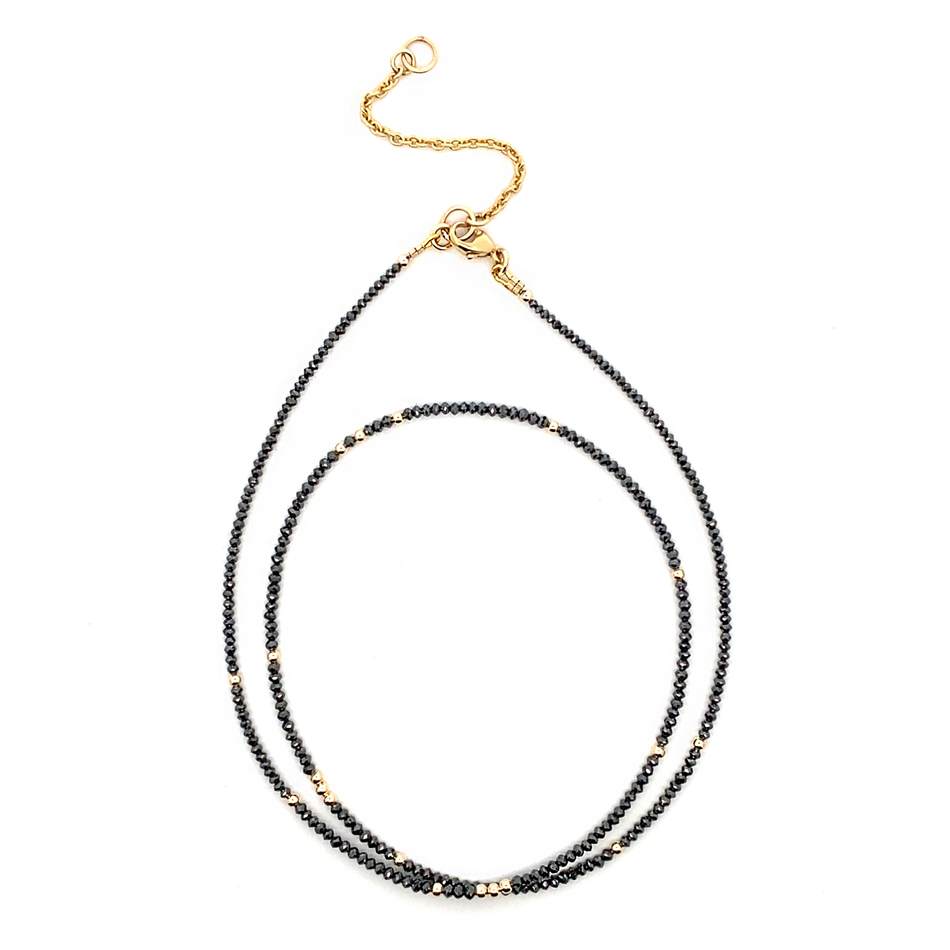 Black diamond beaded necklace with gold clasp on a white background
