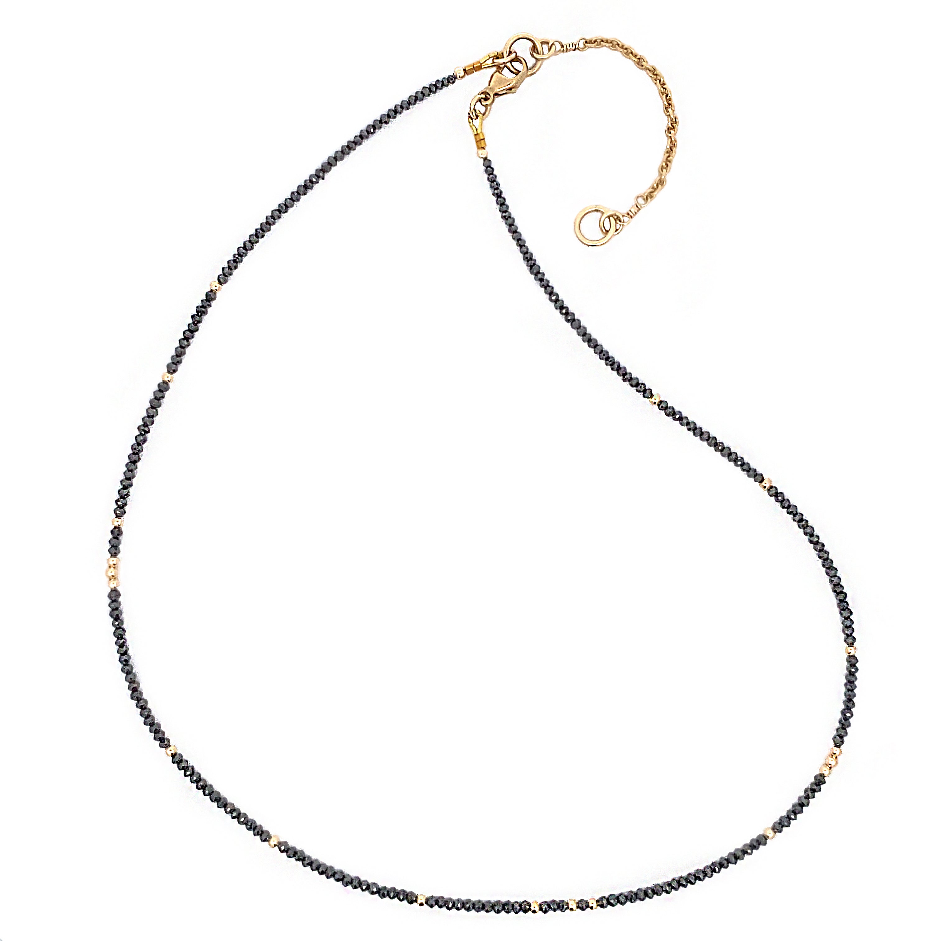 Necklace with black diamond beads and gold clasp on a white background