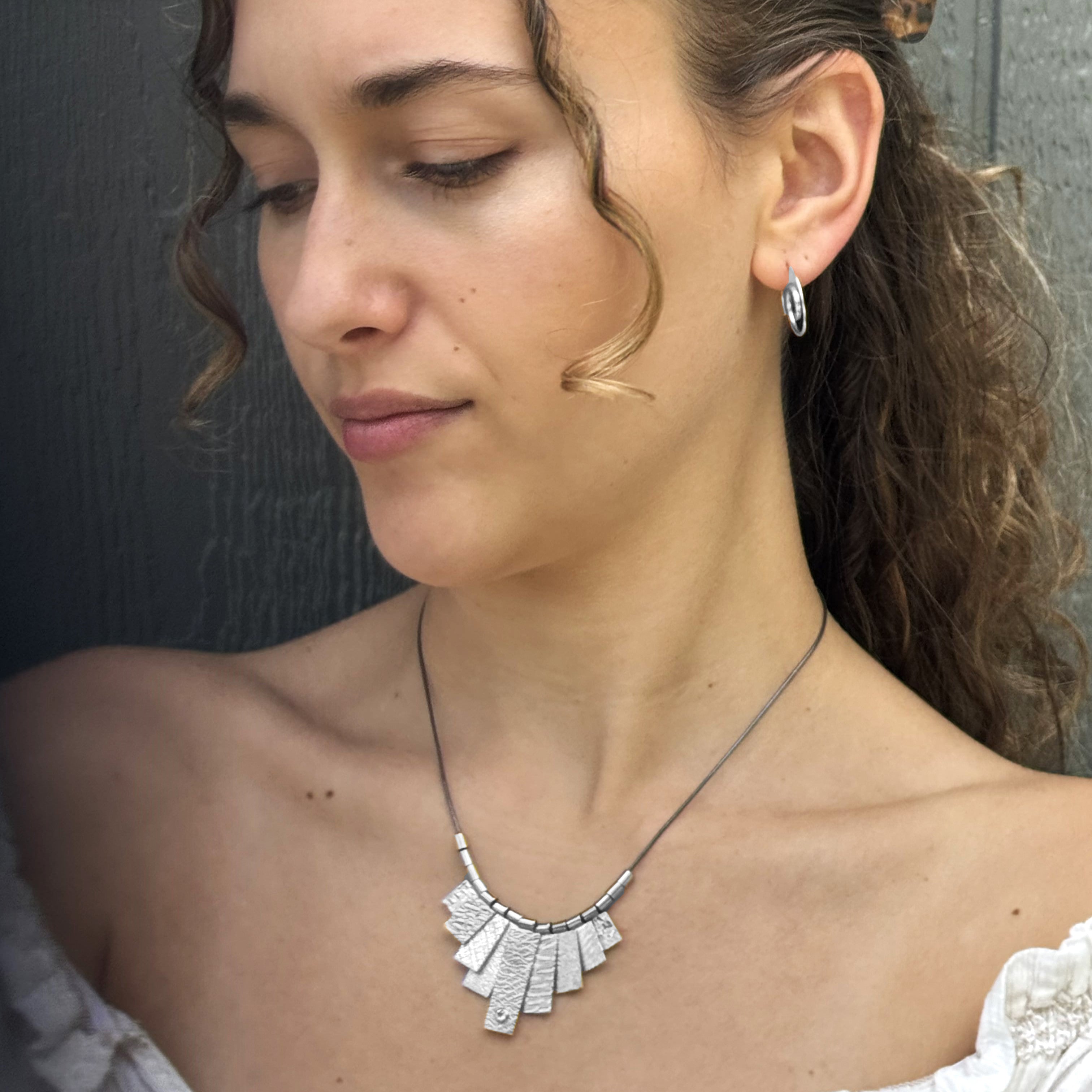 9 Tab Silver Necklace with White Sapphire