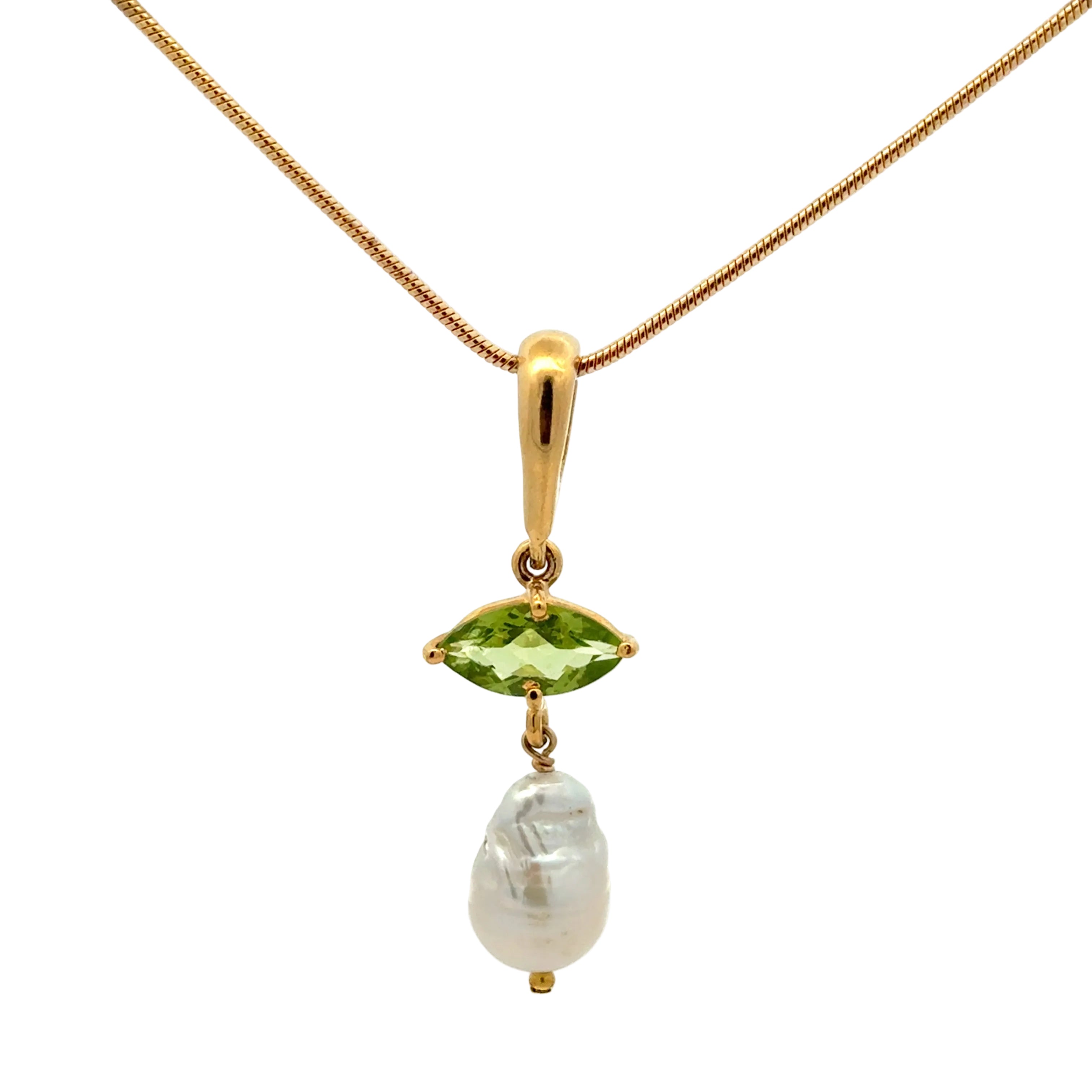 A gold pendant necklace featuring a marquise-cut green gemstone and a dangling baroque pearl, set on a delicate gold chain against a white background.