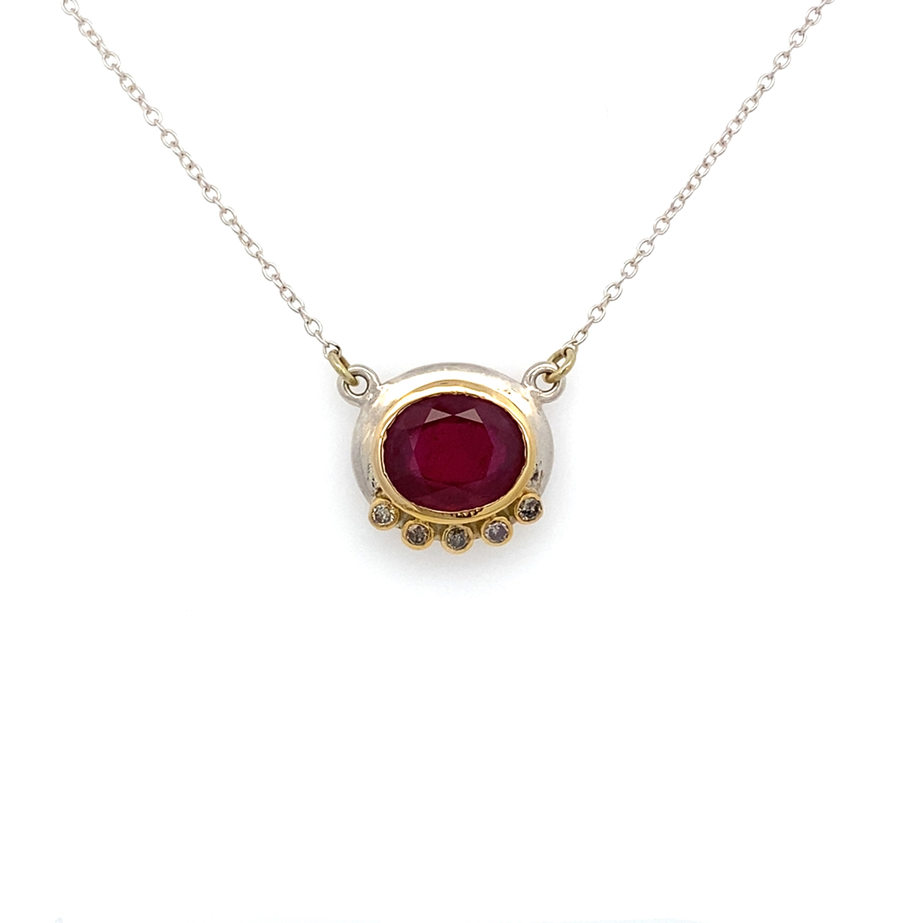 Necklace with a red gemstone pendant on a white background