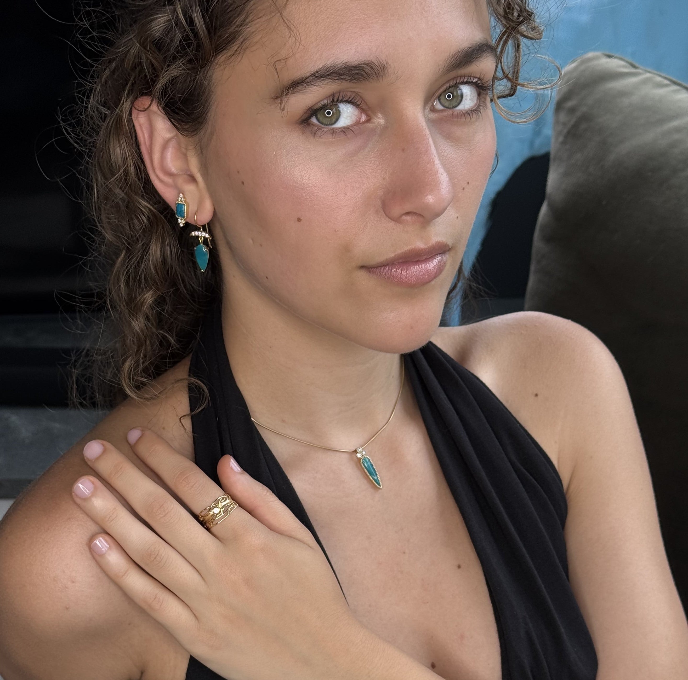 Woman wearing jewelry with a blurred background